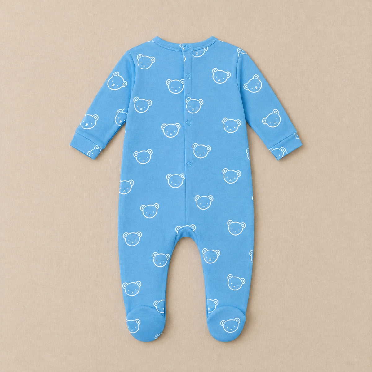 Cornflower blue bear face footed sleepsuit, back, laid flat