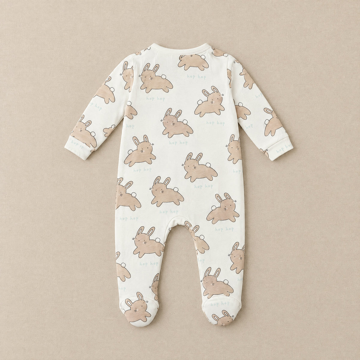 Cream hop hop bunny footed sleepsuit, back, laid flat