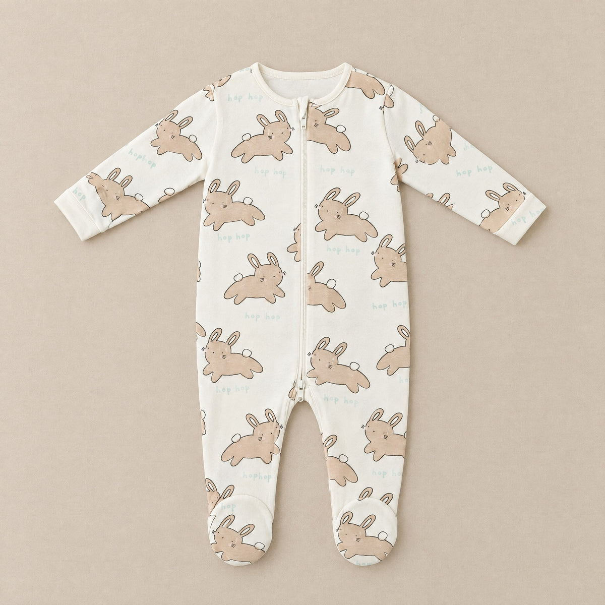 Cream hop hop bunny footed sleepsuit, front, laid flat