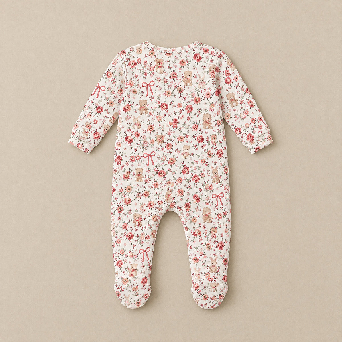 Ivory floral footed sleepsuit, back, laid flat