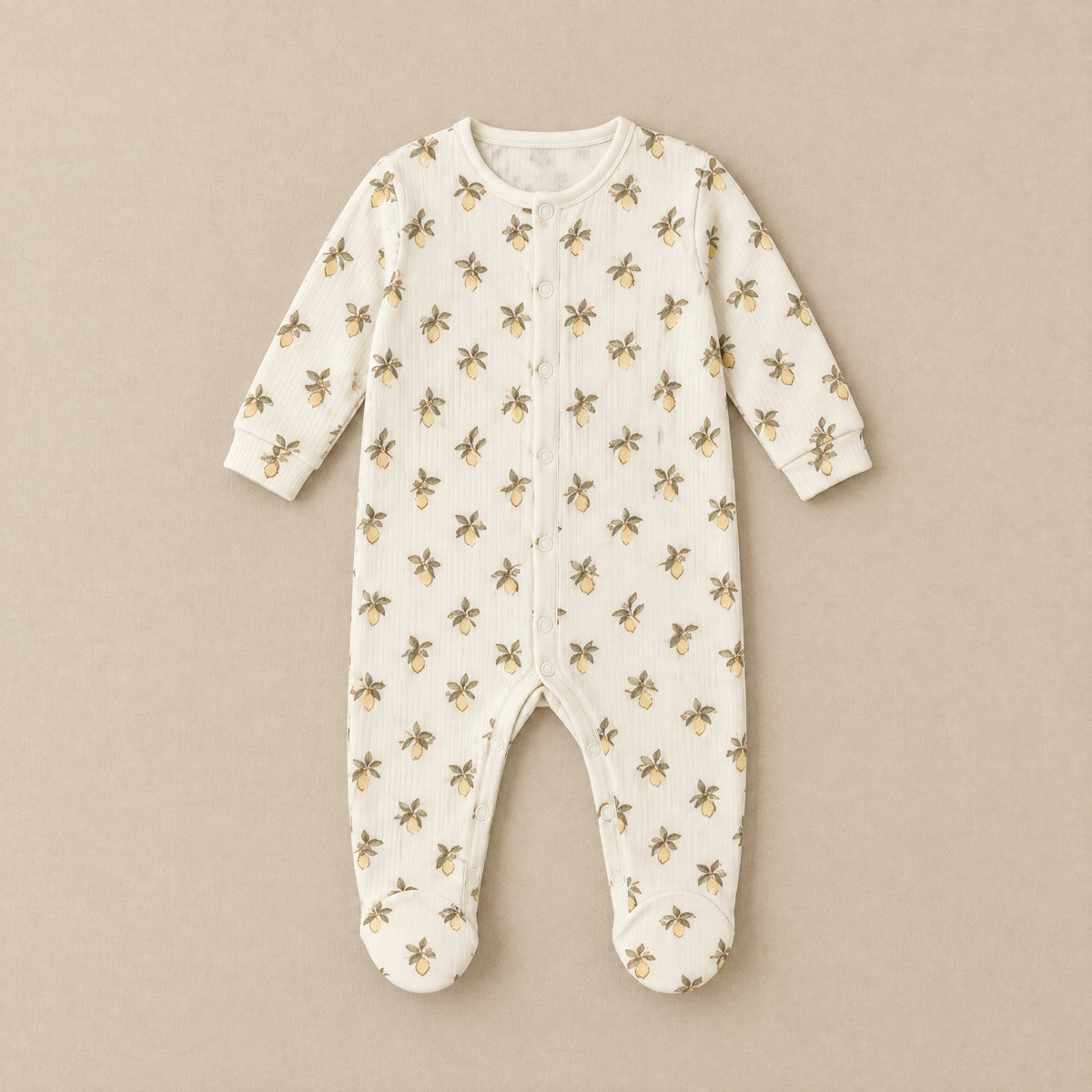 Ivory lemon print footed sleepsuit, front, laid flat