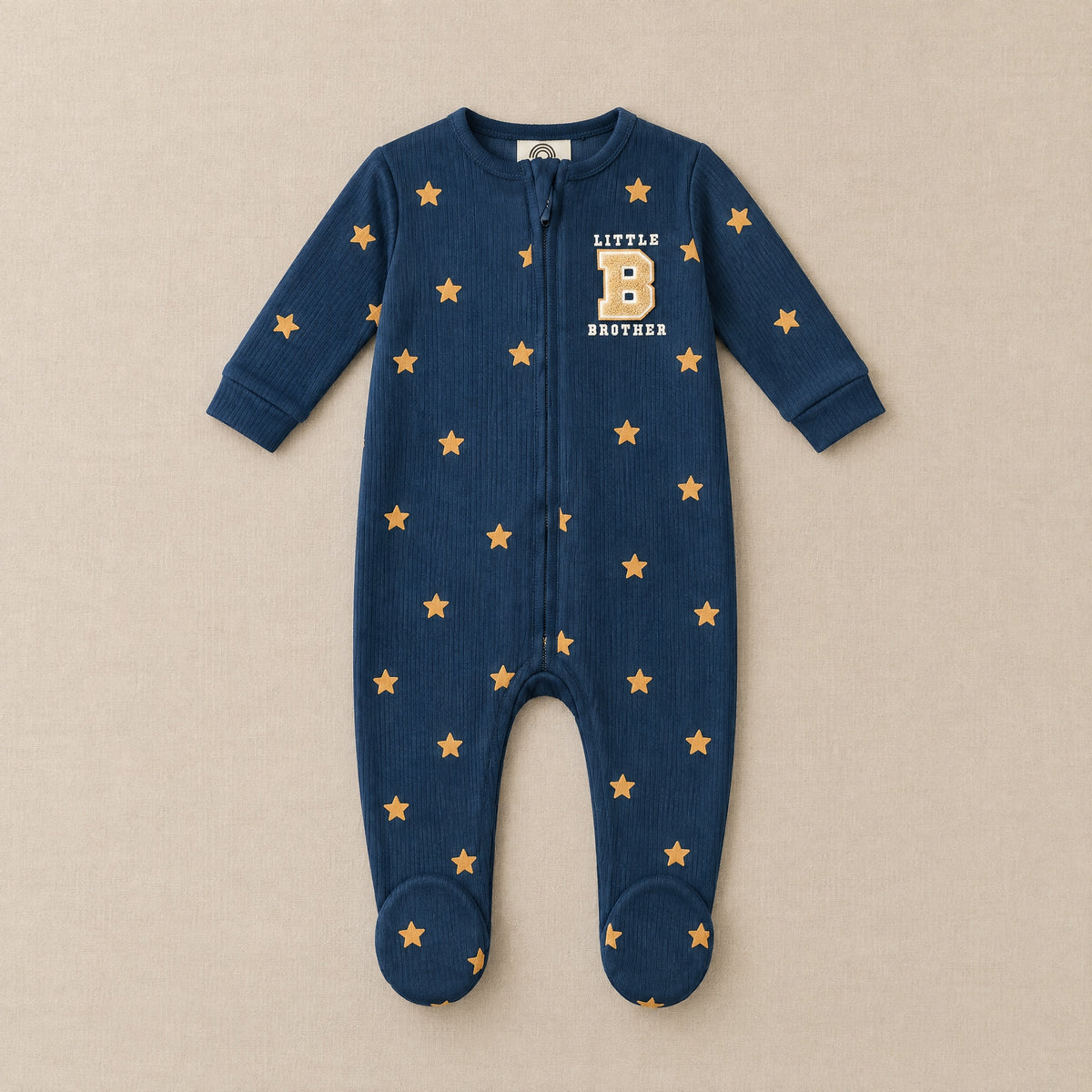 Navy star footed sleepsuit with Little Brother chest patch, front, laid flat