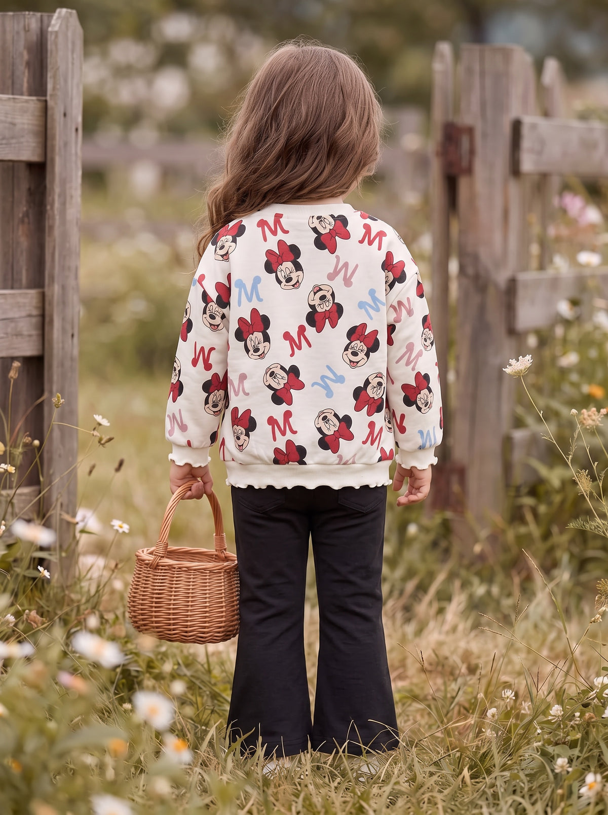 Girl in the field, back view of the set