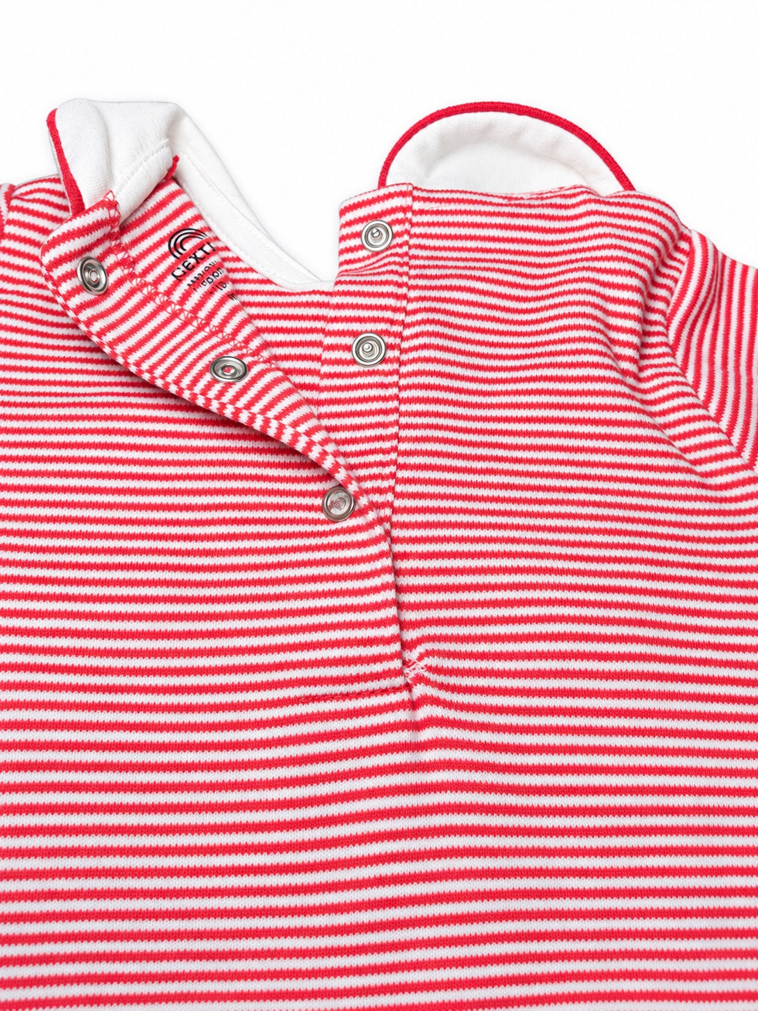 Close-up of the red-stripe sleepsuit's white collar and press-stud back opening
