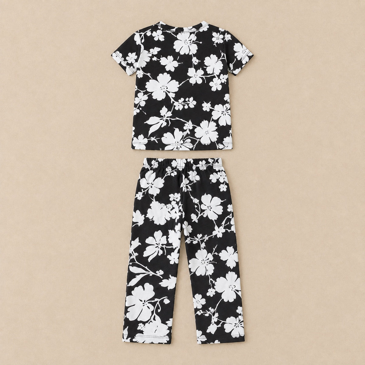 Black and white floral T-shirt and trousers set, back flat lay
