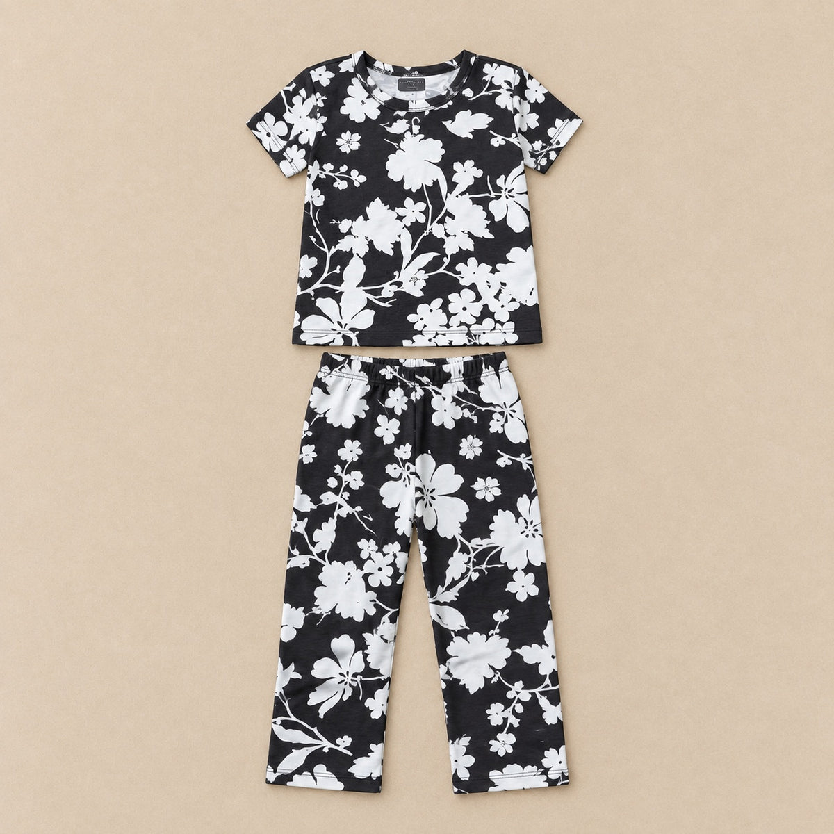 Black and white floral T-shirt and trousers set, front flat lay