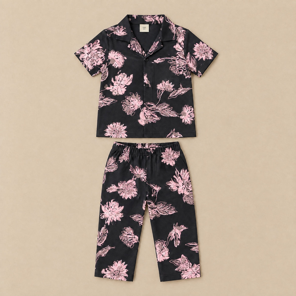 Black and light pink floral shirt and trousers set, flat lay
