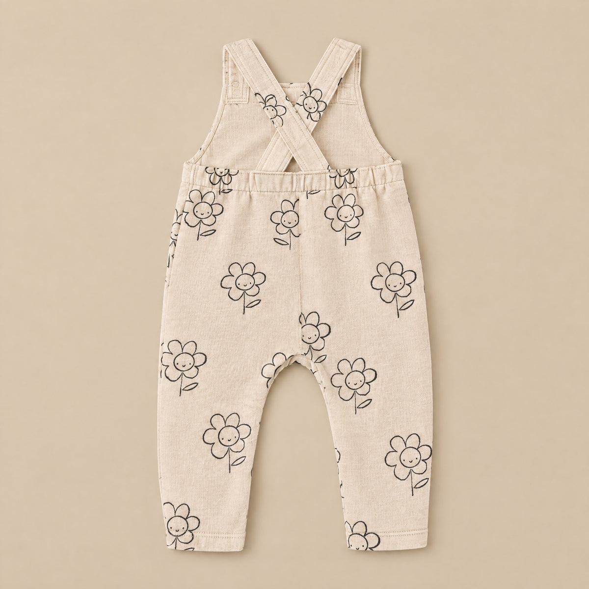 Happy Daisy dungarees laid flat, back with crossed straps