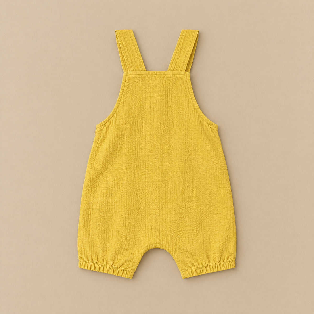 Forest Bellow dungarees laid flat, back