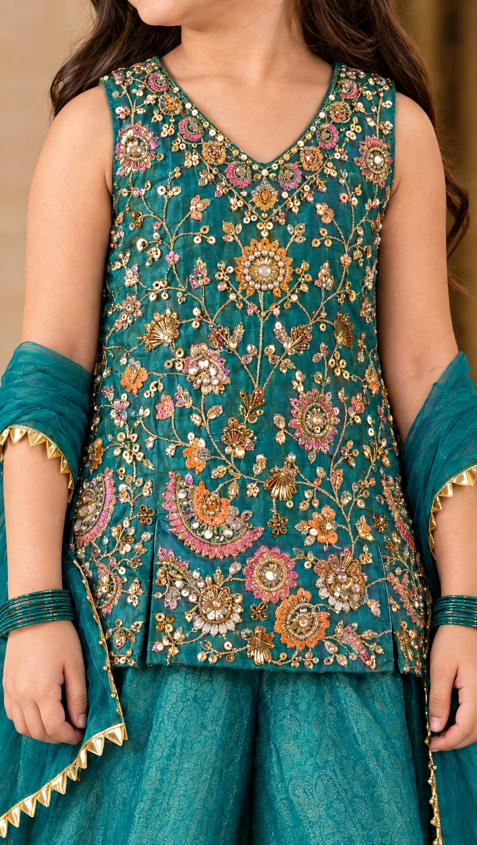 Close-up of the zari, sequin and stone floral embroidery on the kurti front