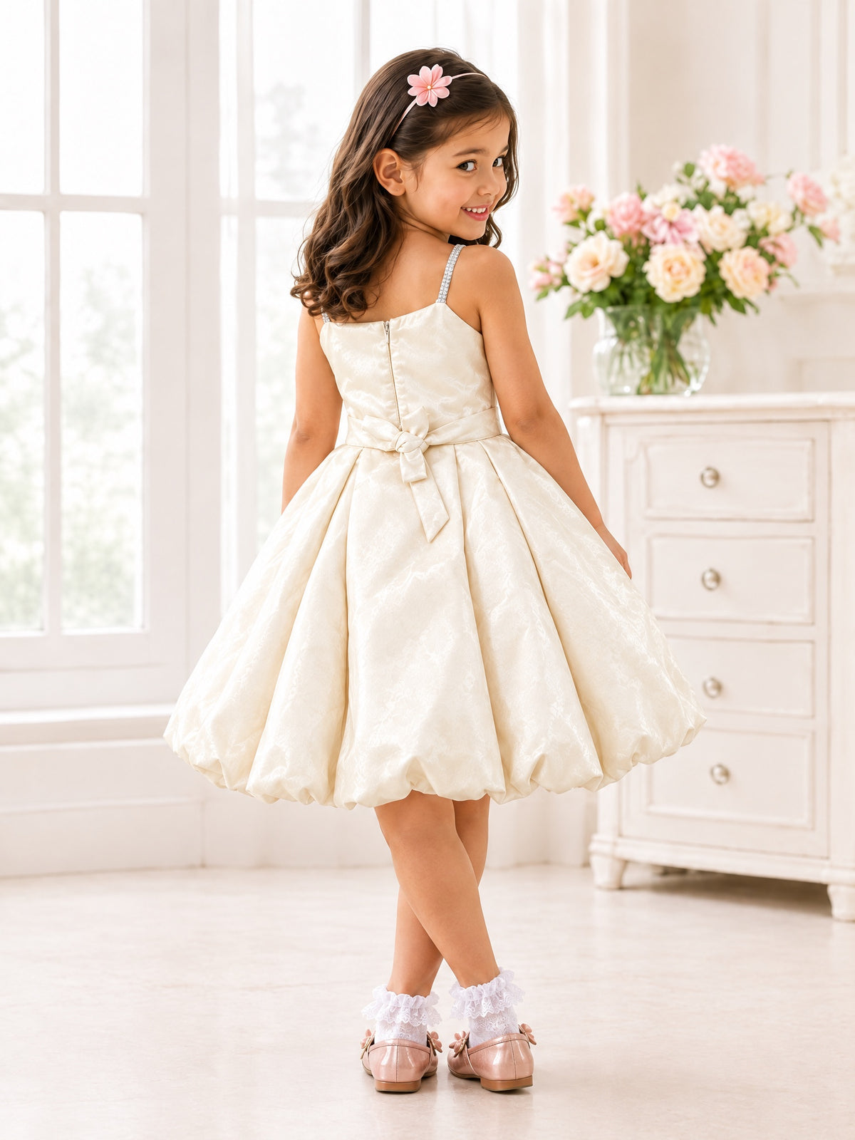 Back view showing the zip, tie-bow sash and full skirt