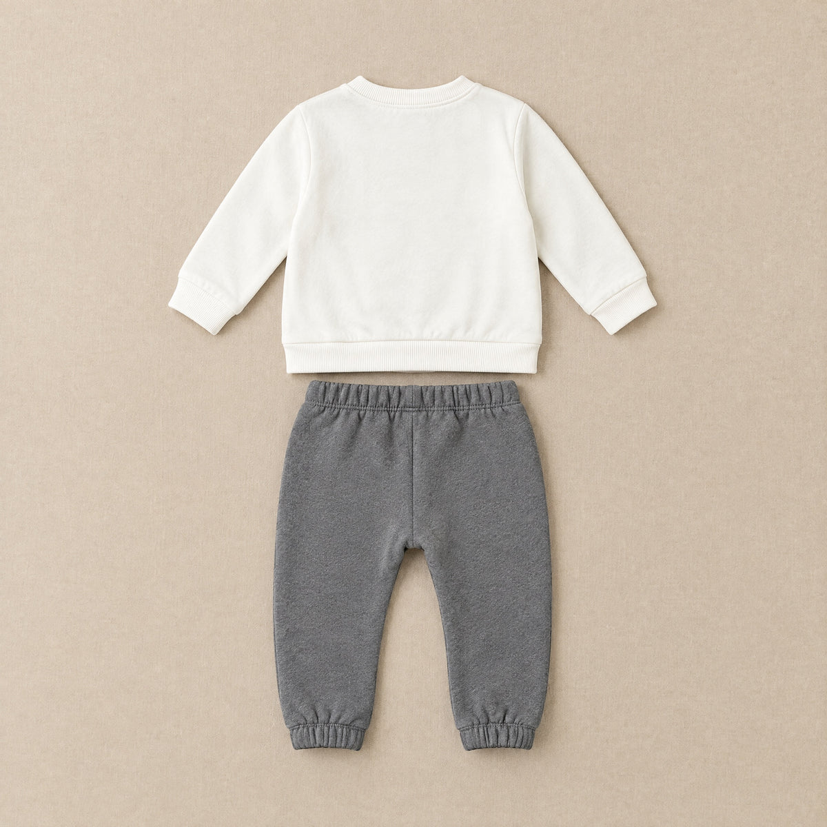 Ivory sweatshirt and charcoal joggers laid flat, back